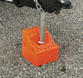 Orange RV Leveling Chock in Use with Stabilizer Jack - Installation View | United RV Parts