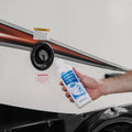 Camco TastePURE Water Freshener Usage - Hand Holding Bottle by RV Water Port | United RV Parts