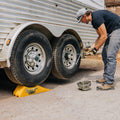 RV Owner Using Trailer-Aid Plus for Tire Maintenance - Action Shot | United RV Parts