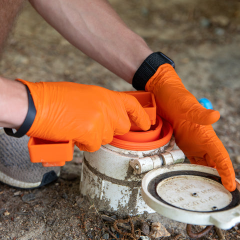 Orange RhinoFLEX Sewer Wrench in Use on RV Dump Station - Hands-On Application | United RV Parts