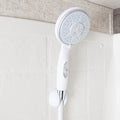 White Camco RV Handheld Shower Head with On/Off Switch Mounted on Tile Wall - In-Use Lifestyle | United RV Parts