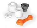 Orange RhinoFLEX Wrench with Various White and Gray Cleanout Plugs - Group View | United RV Parts