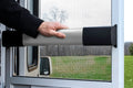 Camco RV Screen Door Cross Bar Installed - Hand Gripping Black Handle | United RV Parts