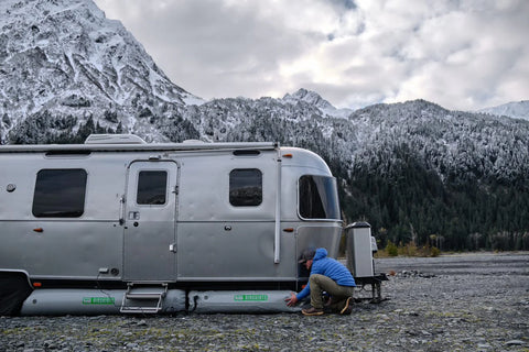 AIRSKIRTS Inflatable RV Skirt Installation - Person Fitting Skirt Tube on Airstream Trailer | United RV Parts