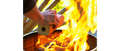 Brown Compressed Firewood Log Being Added to Fire - Action Shot | United RV Parts