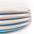 White AquaFlex RV Water Hose Coiled Stack Detail with Blue Stripe - Side View | United RV Parts