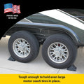 Stromberg Carlson Wheel Chock Securing Dual RV Trailer Tires - In-Use Lifestyle View | United RV Parts