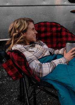Red Plaid Kuma Heated Camping Love Seat Beside Airstream RV - Lifestyle Scene | United RV Parts