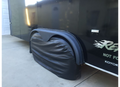 Black ADCO Double Axle Tyre Gard RV Tire Cover - Lifestyle Shot on Trailer | United RV Parts