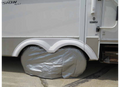 ADCO Silver Vinyl Double Axle Tire Cover Installed on RV - Lifestyle Side View | United RV Parts