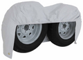 White Vinyl ADCO Double Axle Tire Cover Draping Both Wheels - Angle View | United RV Parts