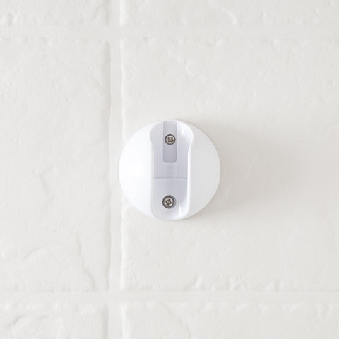 White Round RV Shower Head Wall Mount Bracket with Screws Installed on Tile - Close-Up Detail | United RV Parts