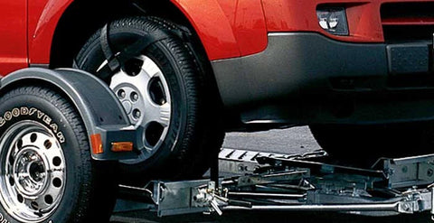 Demco Tow Dolly Loading Red SUV - Close-Up Loading Detail | United RV Parts