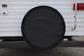 ADCO 1734 Black Spare Tire Cover Installed on RV Travel Trailer - Lifestyle View | United RV Parts
